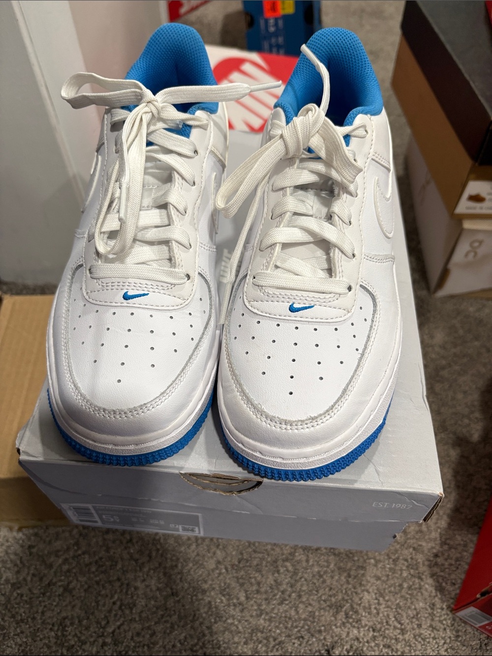 Nike Kids White Sneakers with Bright Blue Accents